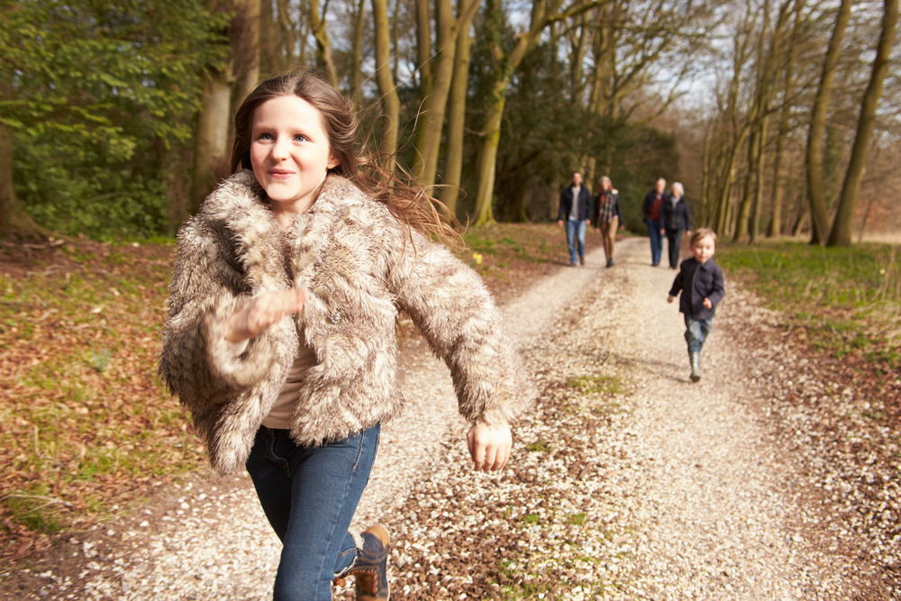 Multi-generation family on countryside walk in Surrey.